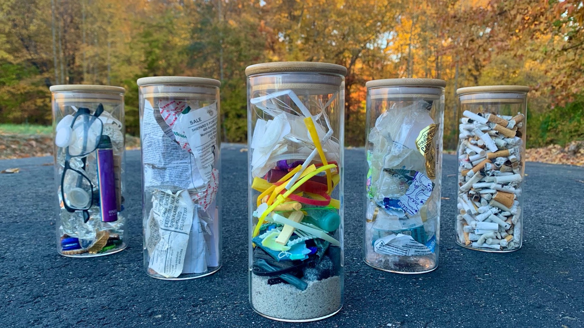 Beach Pollution art piece - five jars, each containing different types of trash